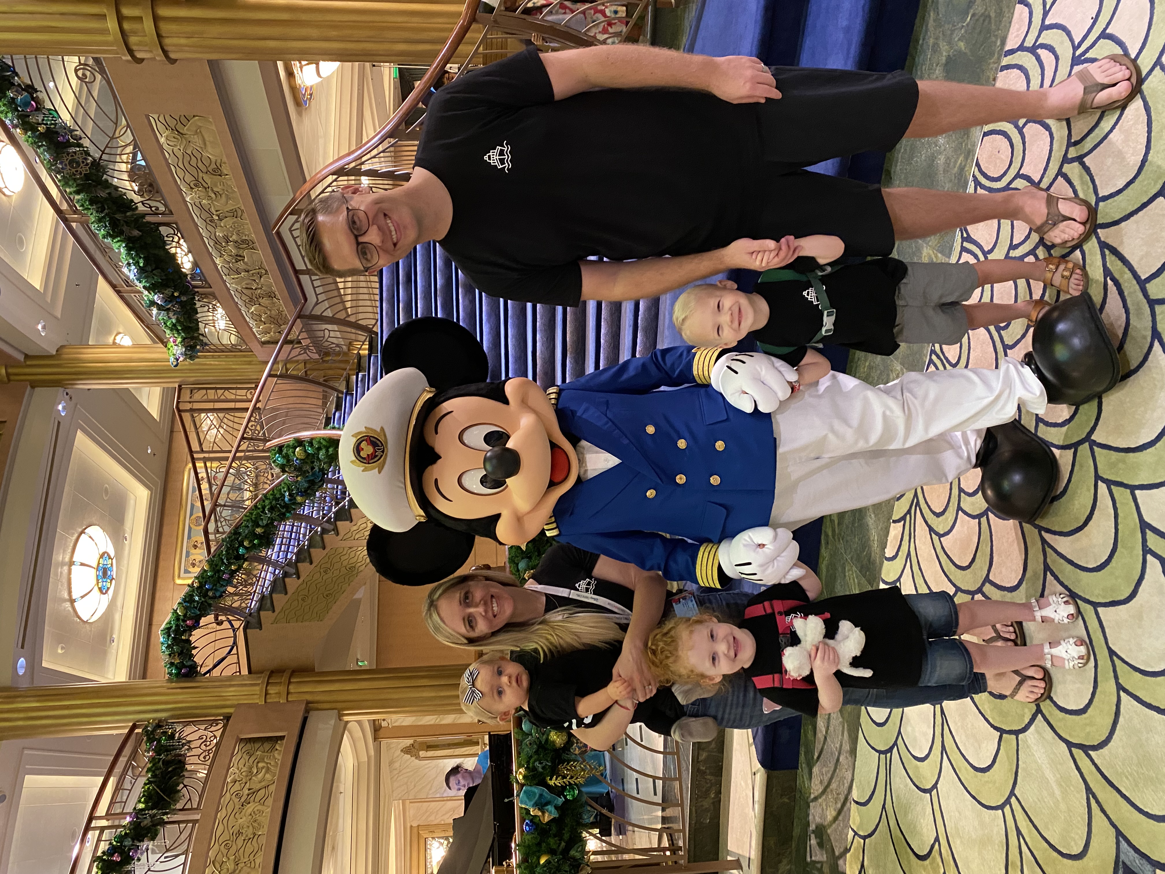 Christine and family with Captain Mickey Mouse on Disney Fantasy - Disney Cruise travel agent Pleasant Grove Utah